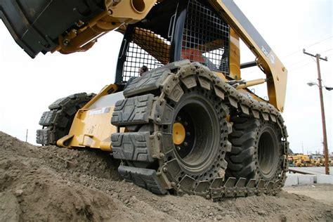 snow tracks skid steer|wheeled vs tracked skid steer.